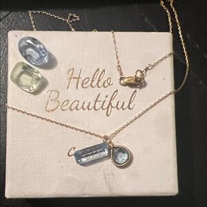 Elegant Gold Necklace with Blue Gemstone